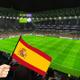 Un campo de fútbol y un banderín de España animando