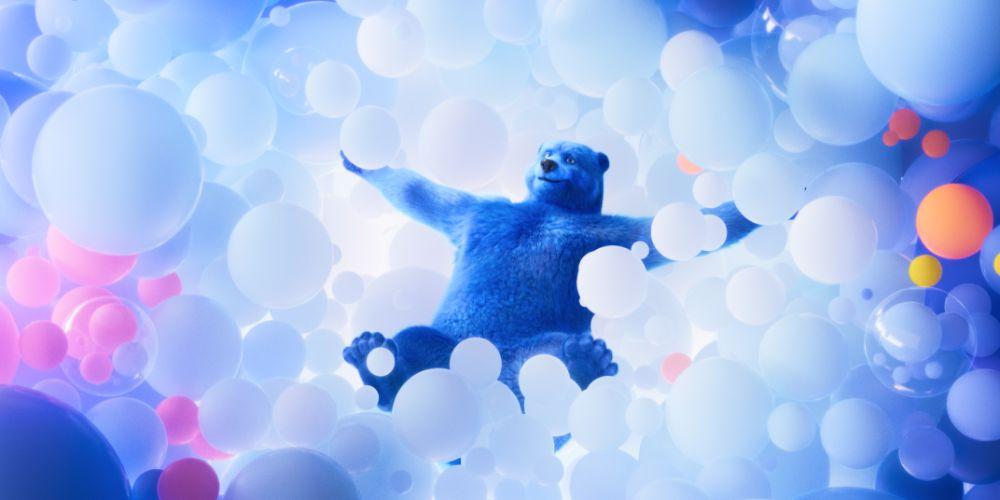 El oso de O2 dando un salto entre burbujas