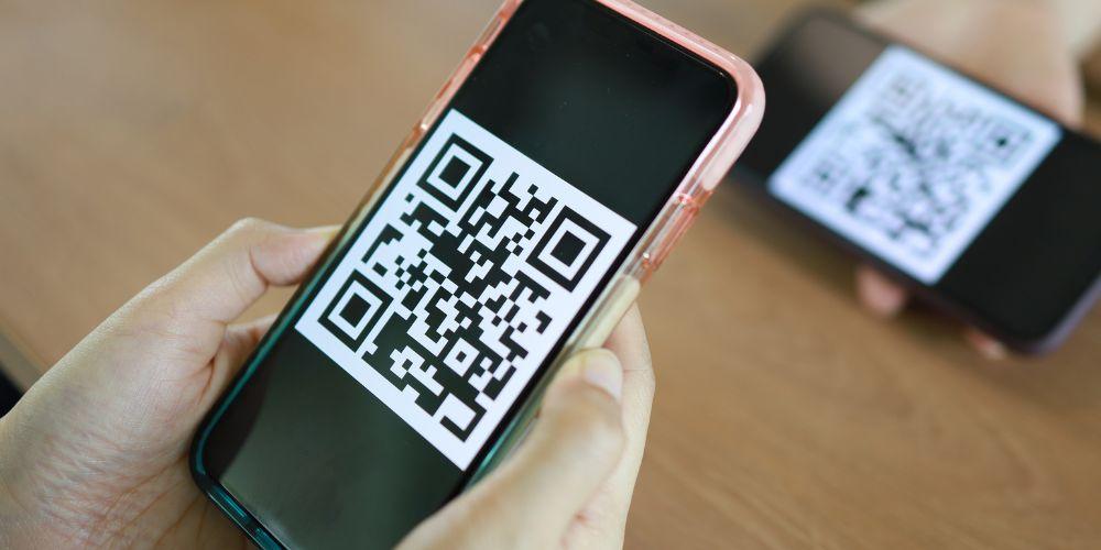 User uses his mobile phone to read a QR code